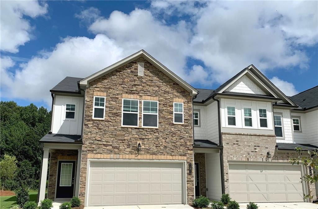 1369 Cooper Springs Road, Unit 1369 Grayson, GA 30017 - Photo 1 of 1 Stone front facade w/ Board & Batten Hardiplank cement siding. Photo example only.