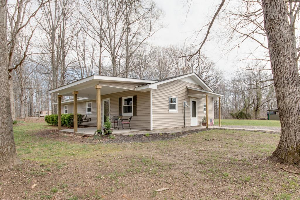1020 Lambert Ridge Road Wartrace, TN 37183 - Photo 2 of 30 a front view of a house with garden
