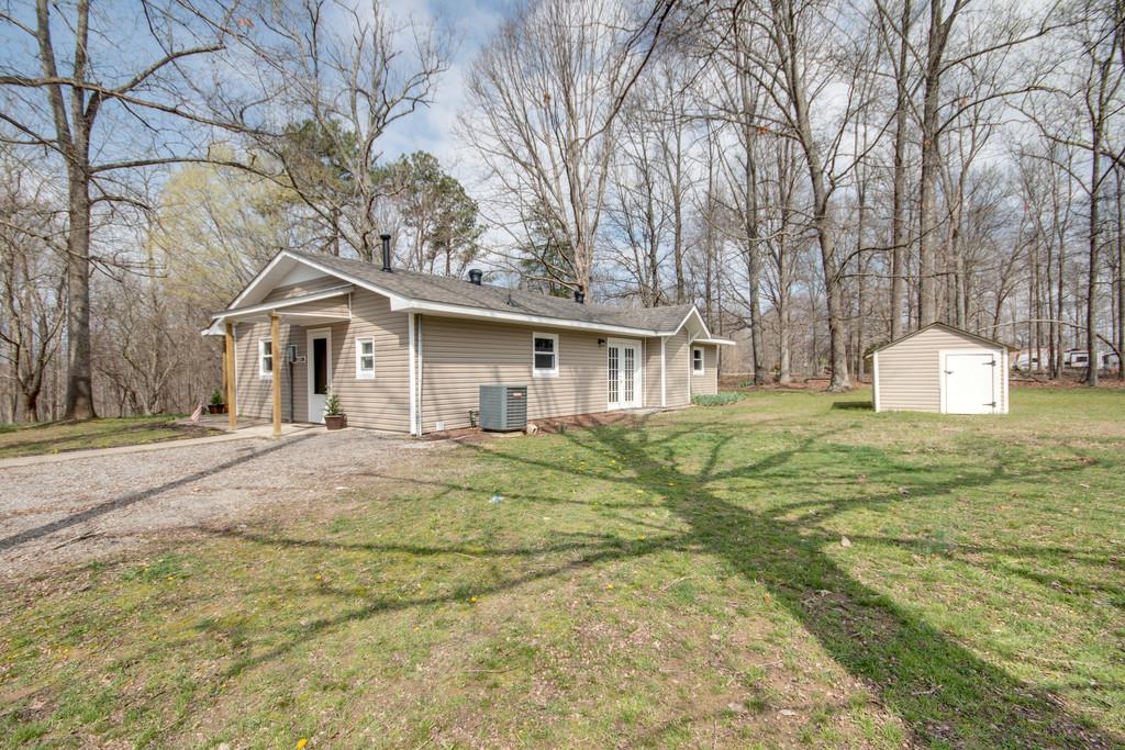 1020 Lambert Ridge Road Wartrace, TN 37183 - Photo 20 of 30 a front view of a house with a yard and garage