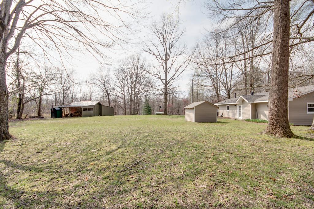 1020 Lambert Ridge Road Wartrace, TN 37183 - Photo 22 of 30 a front view of a house with a yard and garage