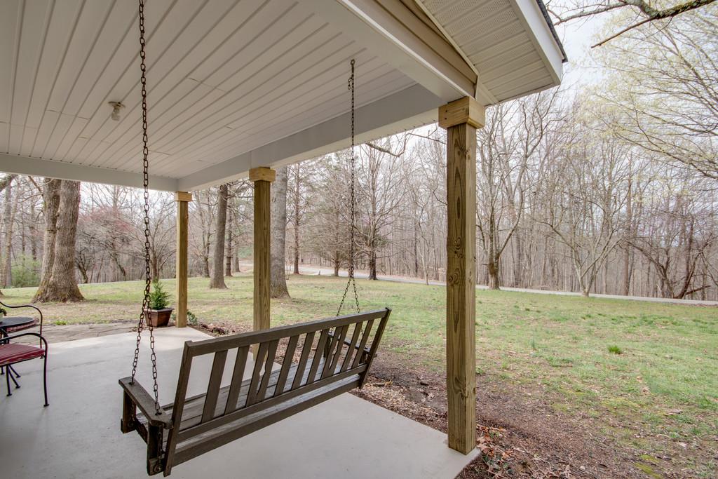 1020 Lambert Ridge Road Wartrace, TN 37183 - Photo 28 of 30 a view of a patio with a table chairs and a backyard
