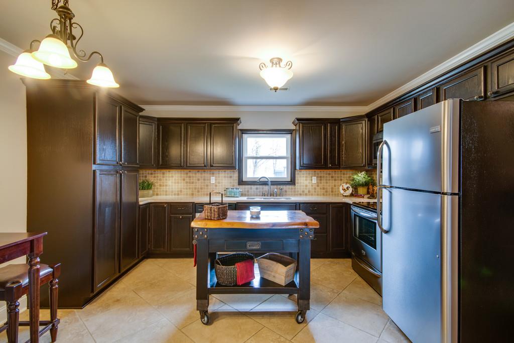 1020 Lambert Ridge Road Wartrace, TN 37183 - Photo 4 of 30 a kitchen with refrigerator cabinets and furniture