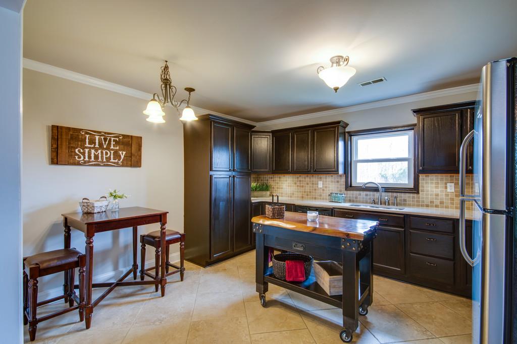 1020 Lambert Ridge Road Wartrace, TN 37183 - Photo 7 of 30 a room with a table chairs and kitchen view