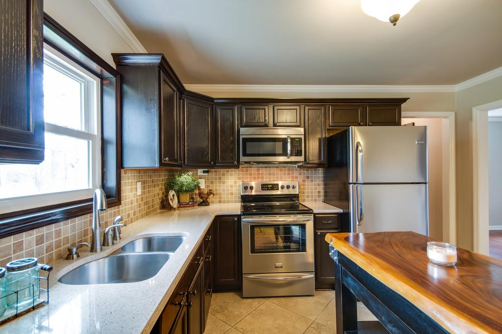 1020 Lambert Ridge Road Wartrace, TN 37183 - Photo 8 of 30 a kitchen with refrigerator cabinets and furniture