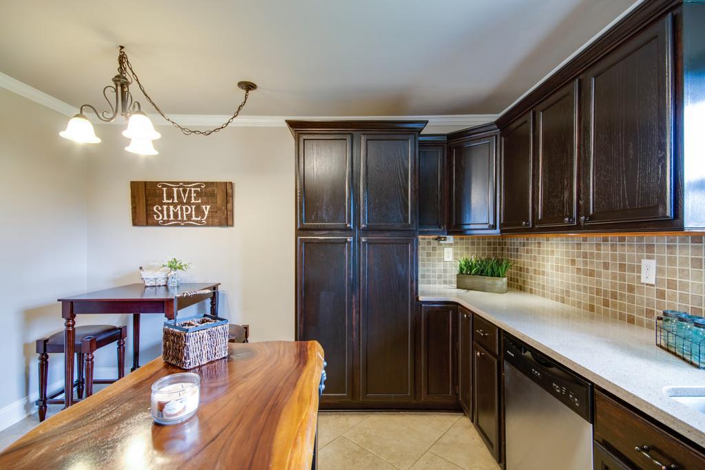 1020 Lambert Ridge Road Wartrace, TN 37183 - Photo 9 of 30 a kitchen with stainless steel appliances granite countertop a sink refrigerator and cabinets