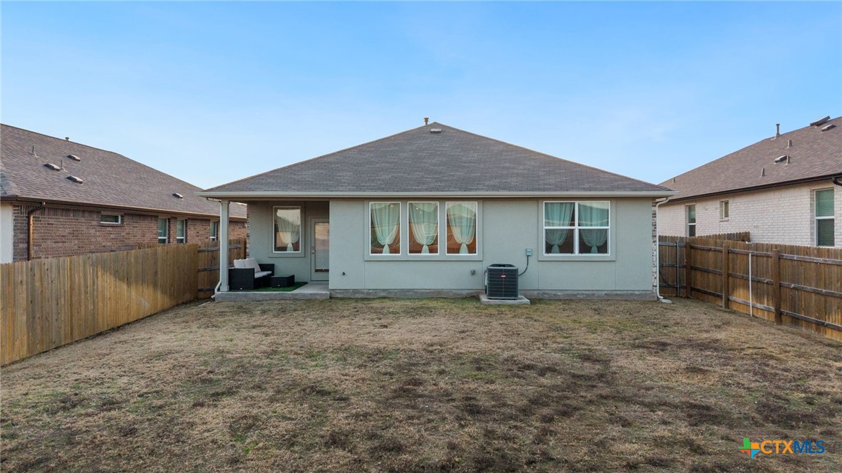 205 Charles Trail Georgetown, TX 78626 - Photo 27 of 38 a view of a house with backyard and roof