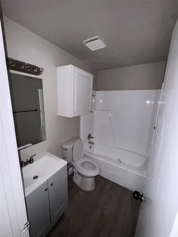 a bathroom with a sink a toilet and a bathtub