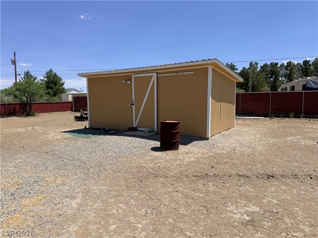 1391 West Dyer Road Pahrump, NV 89048 - Photo 25 of 50 A versatile storage shed provides practical utility within this property's boundaries.