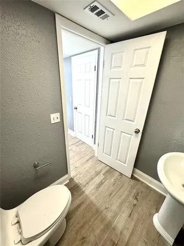a bathroom with a toilet a sink and a bathtub