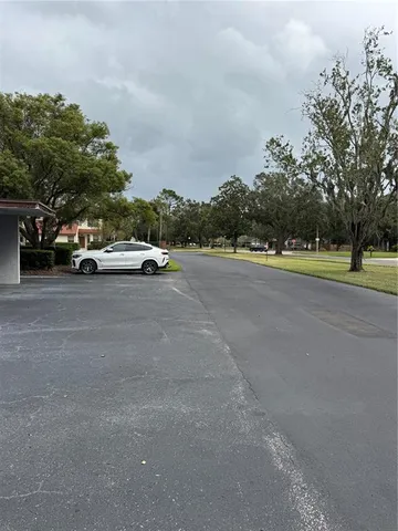 a view of street with parked cars