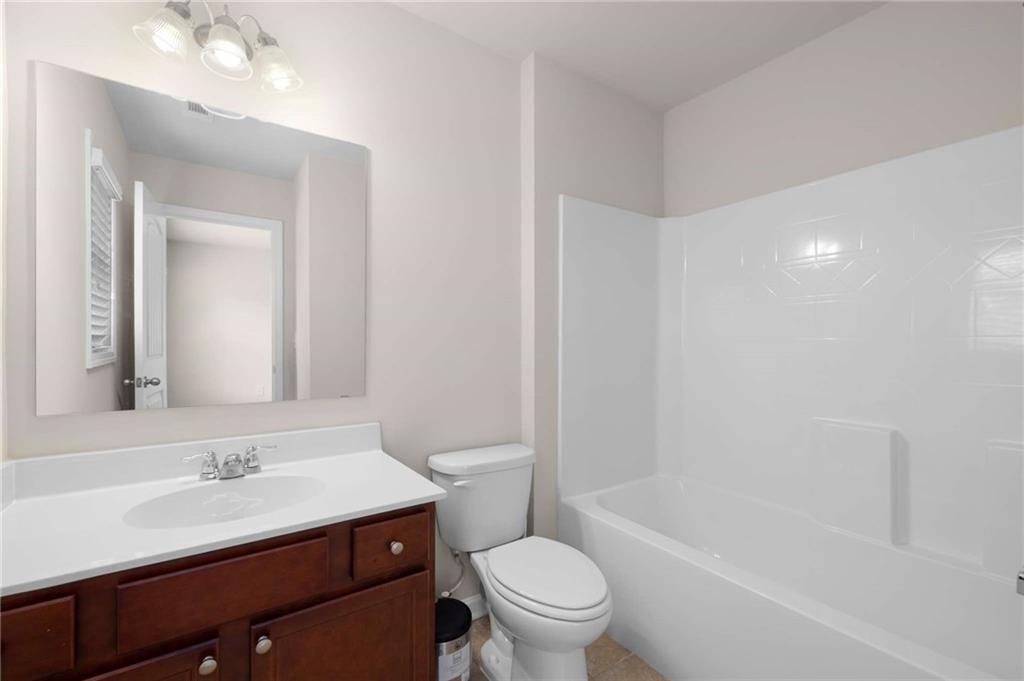 3084 Turman Circle Decatur, GA 30033 - Photo 20 of 36 a bathroom with a sink a toilet and shower