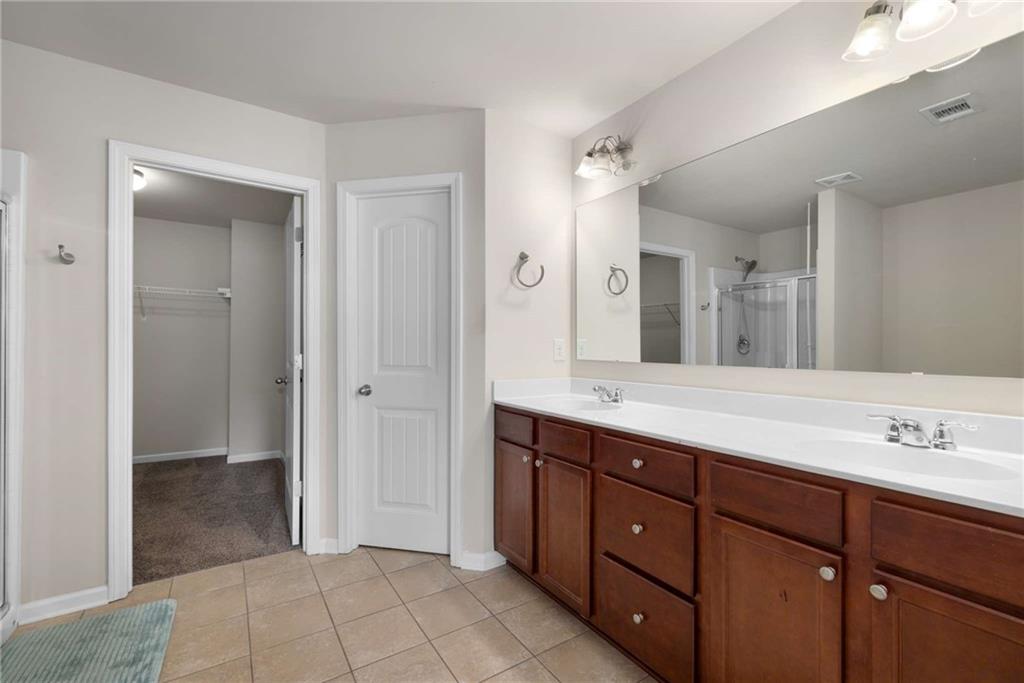 3084 Turman Circle Decatur, GA 30033 - Photo 24 of 36 a spacious bathroom with a granite countertop sink mirror and a