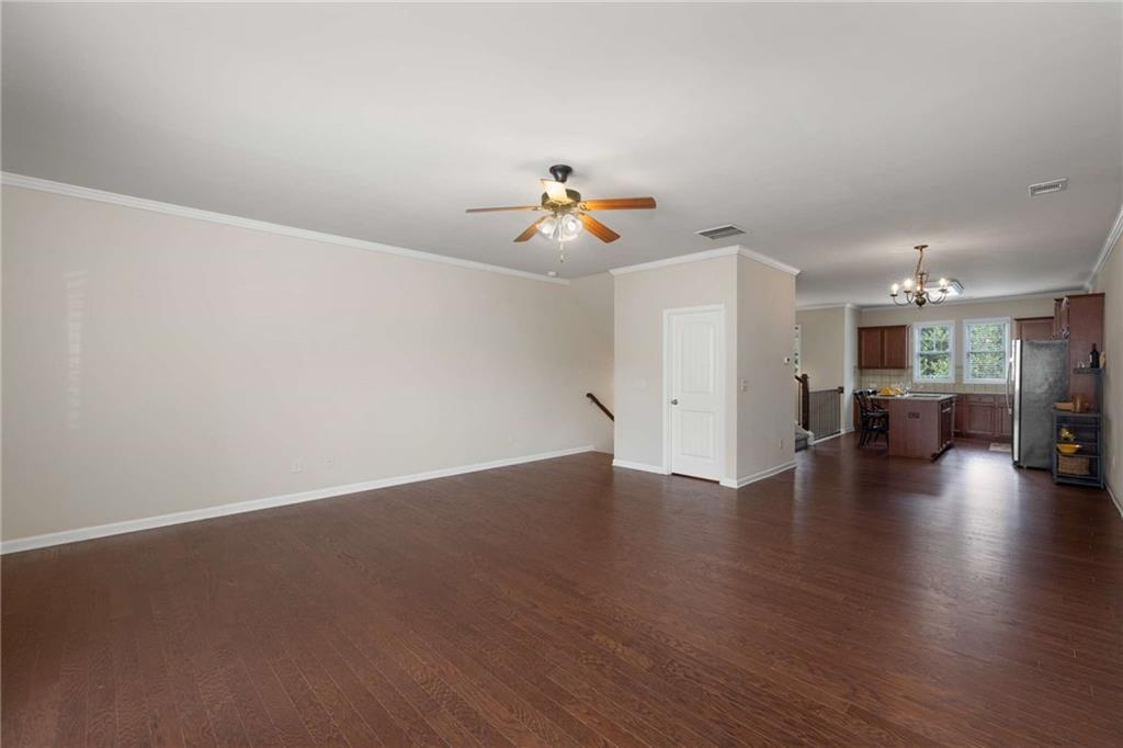 3084 Turman Circle Decatur, GA 30033 - Photo 5 of 36 a view of a livingroom with furniture wooden floor and a ceiling fan