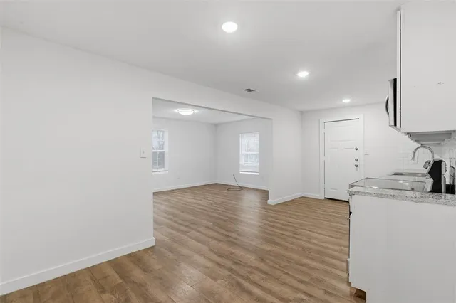 a view of a kitchen sink and a stove top oven