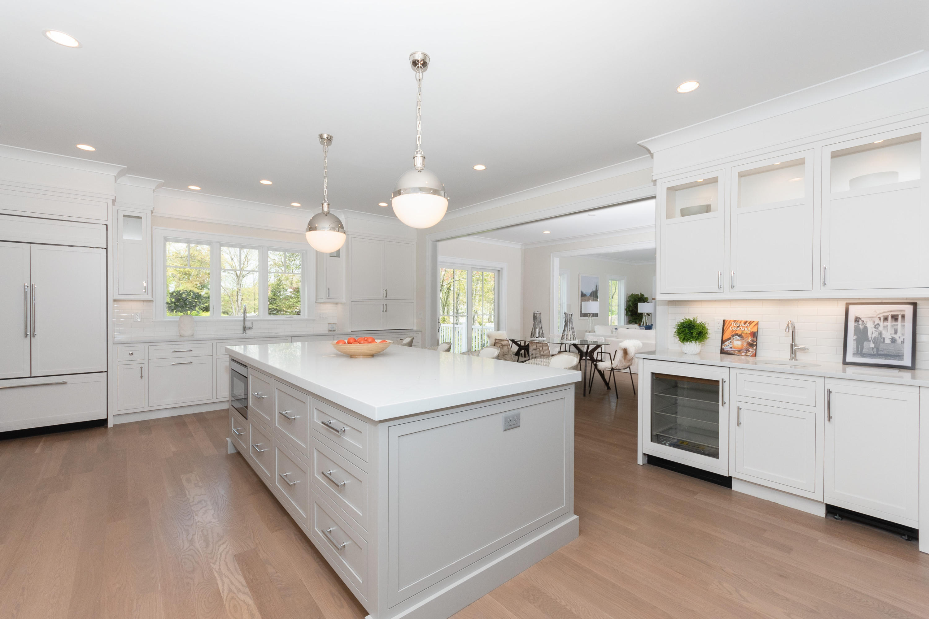 113 Hollow Tree Ridge Road Darien, CT 06820 - Photo 12 of 48 a kitchen with white cabinets and white appliances