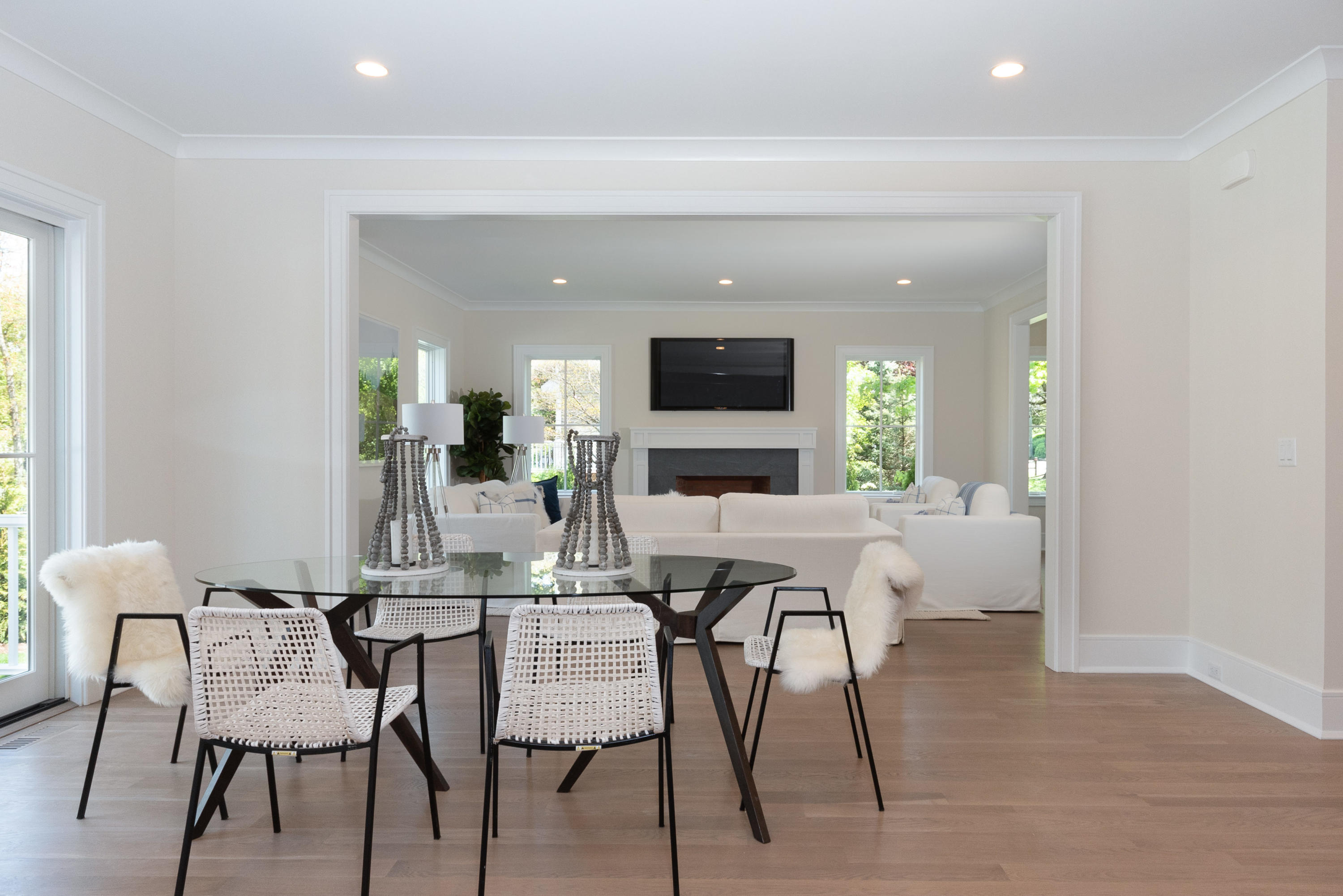 113 Hollow Tree Ridge Road Darien, CT 06820 - Photo 16 of 48 a view of a dining room with furniture window and wooden floor