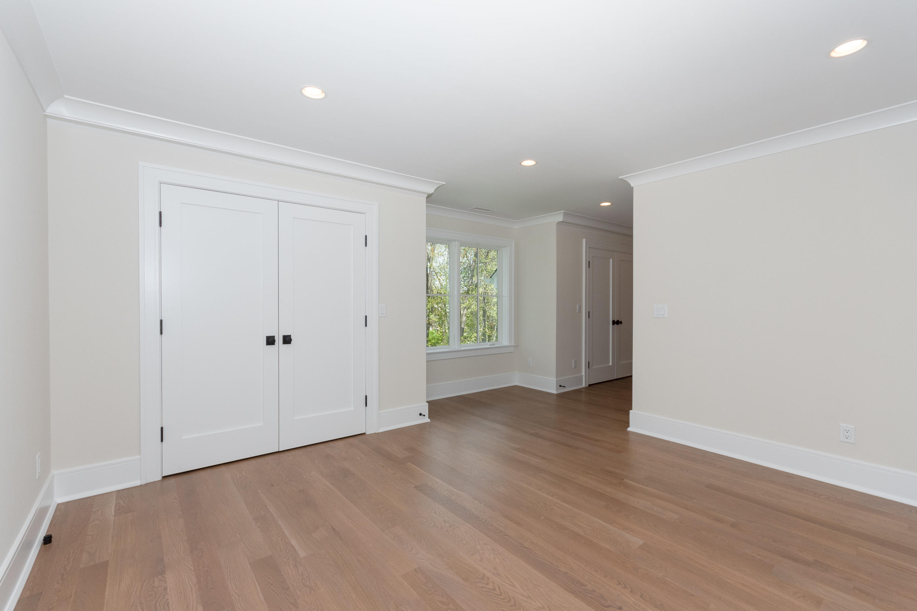113 Hollow Tree Ridge Road Darien, CT 06820 - Photo 30 of 48 a view of an empty room with wooden floor
