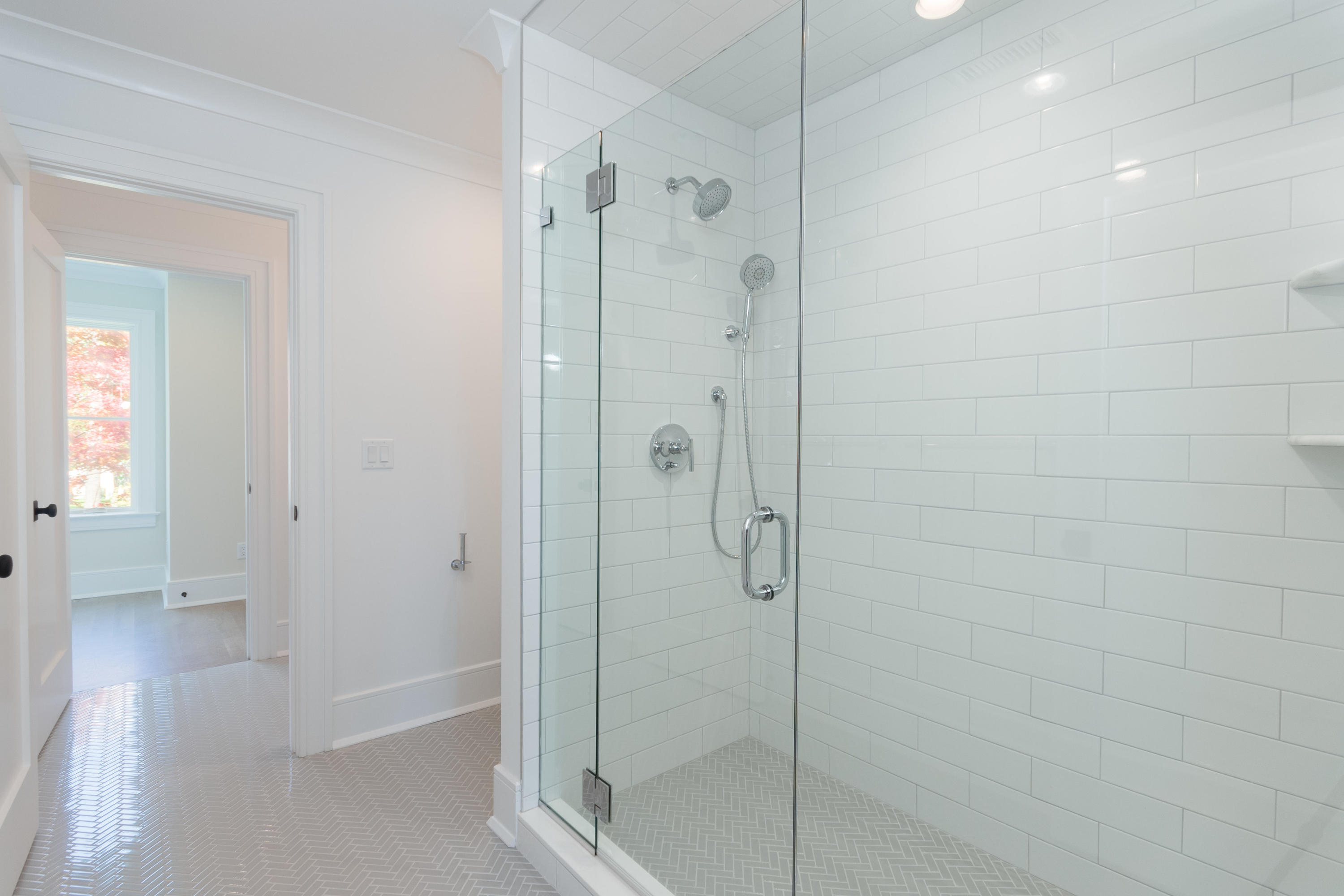 113 Hollow Tree Ridge Road Darien, CT 06820 - Photo 32 of 48 a bathroom with a shower and a glass door