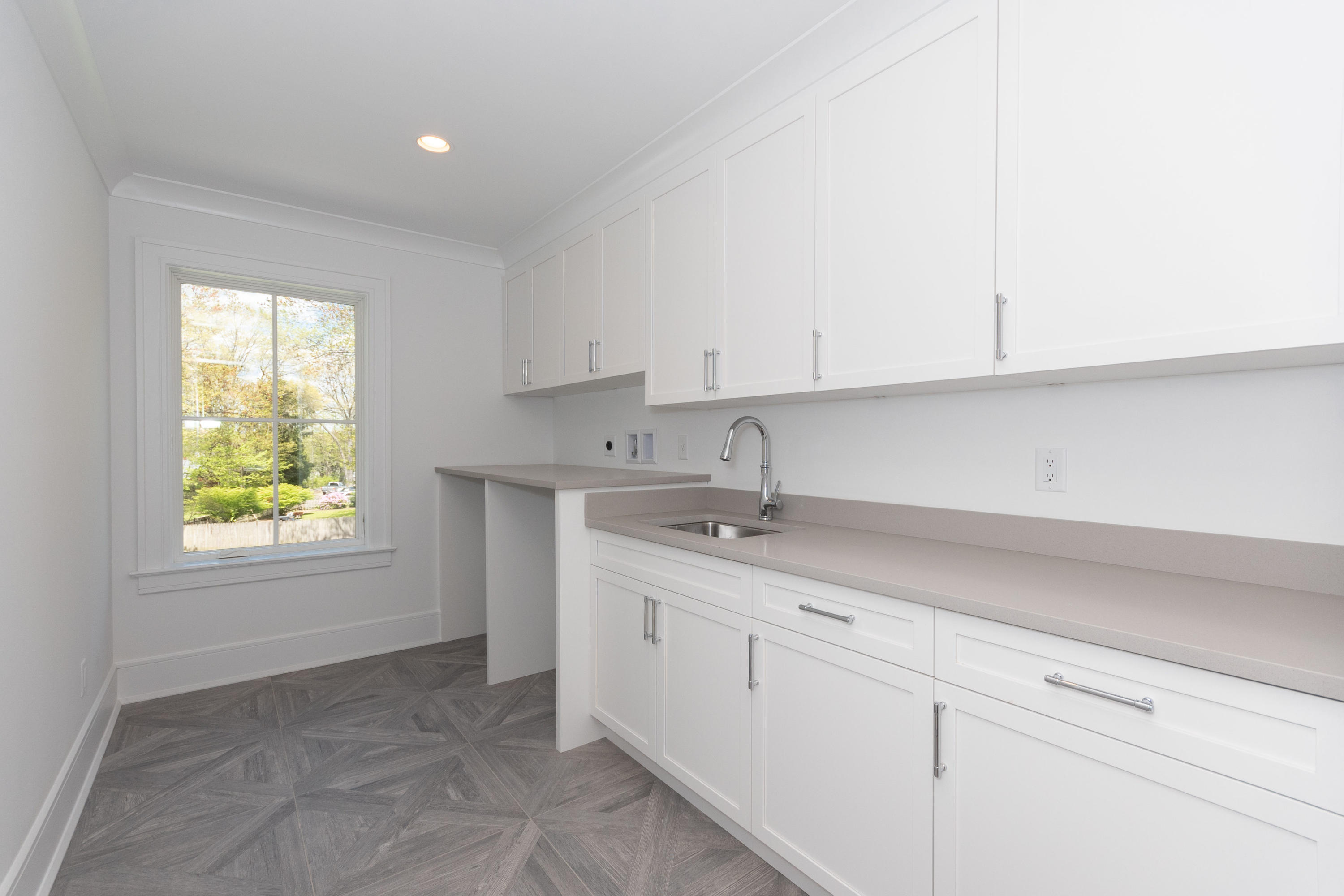 113 Hollow Tree Ridge Road Darien, CT 06820 - Photo 33 of 48 a kitchen with a sink cabinets and window