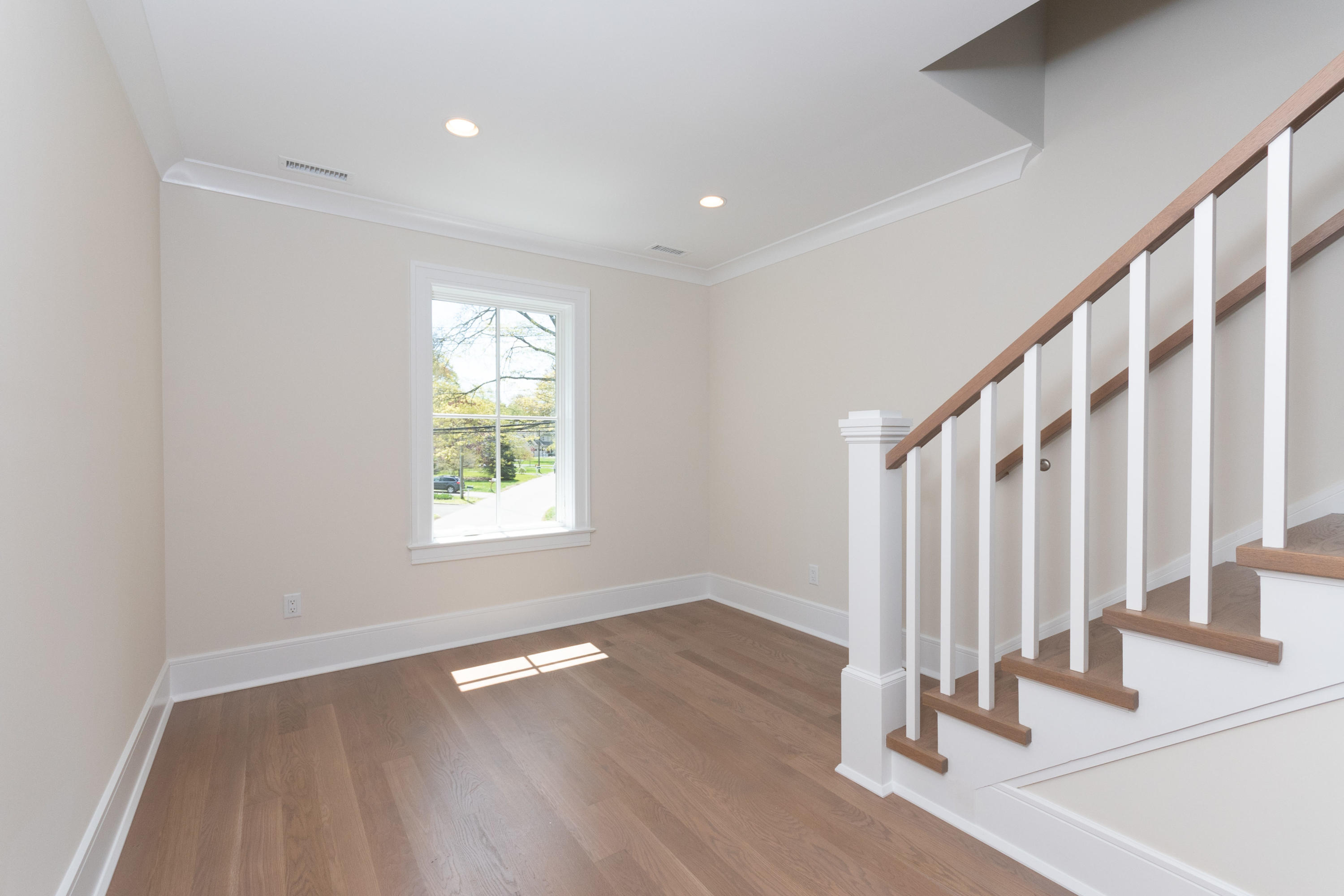 113 Hollow Tree Ridge Road Darien, CT 06820 - Photo 34 of 48 a view of an empty room with wooden floor and a window