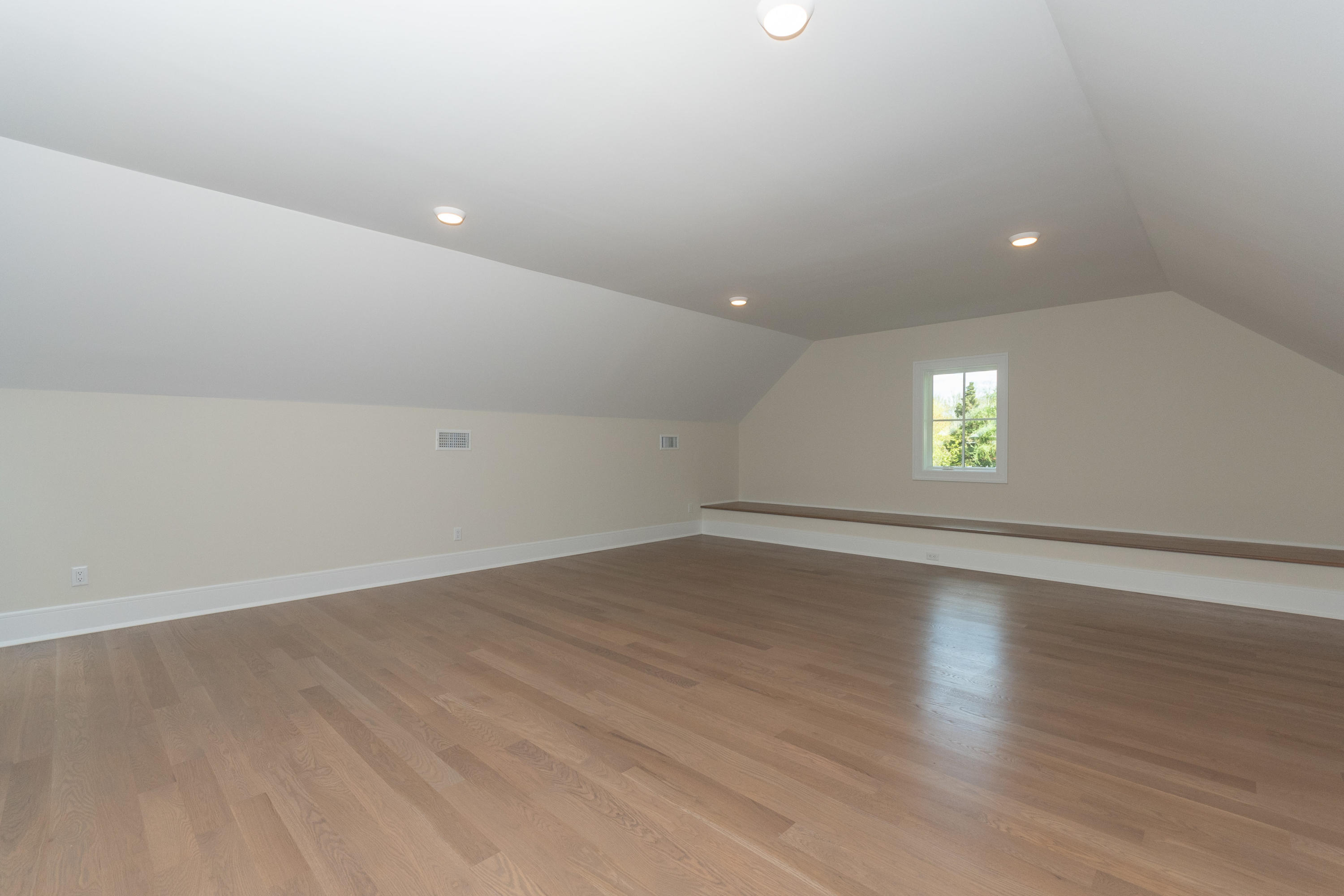 113 Hollow Tree Ridge Road Darien, CT 06820 - Photo 35 of 48 an empty room with wooden floor and windows
