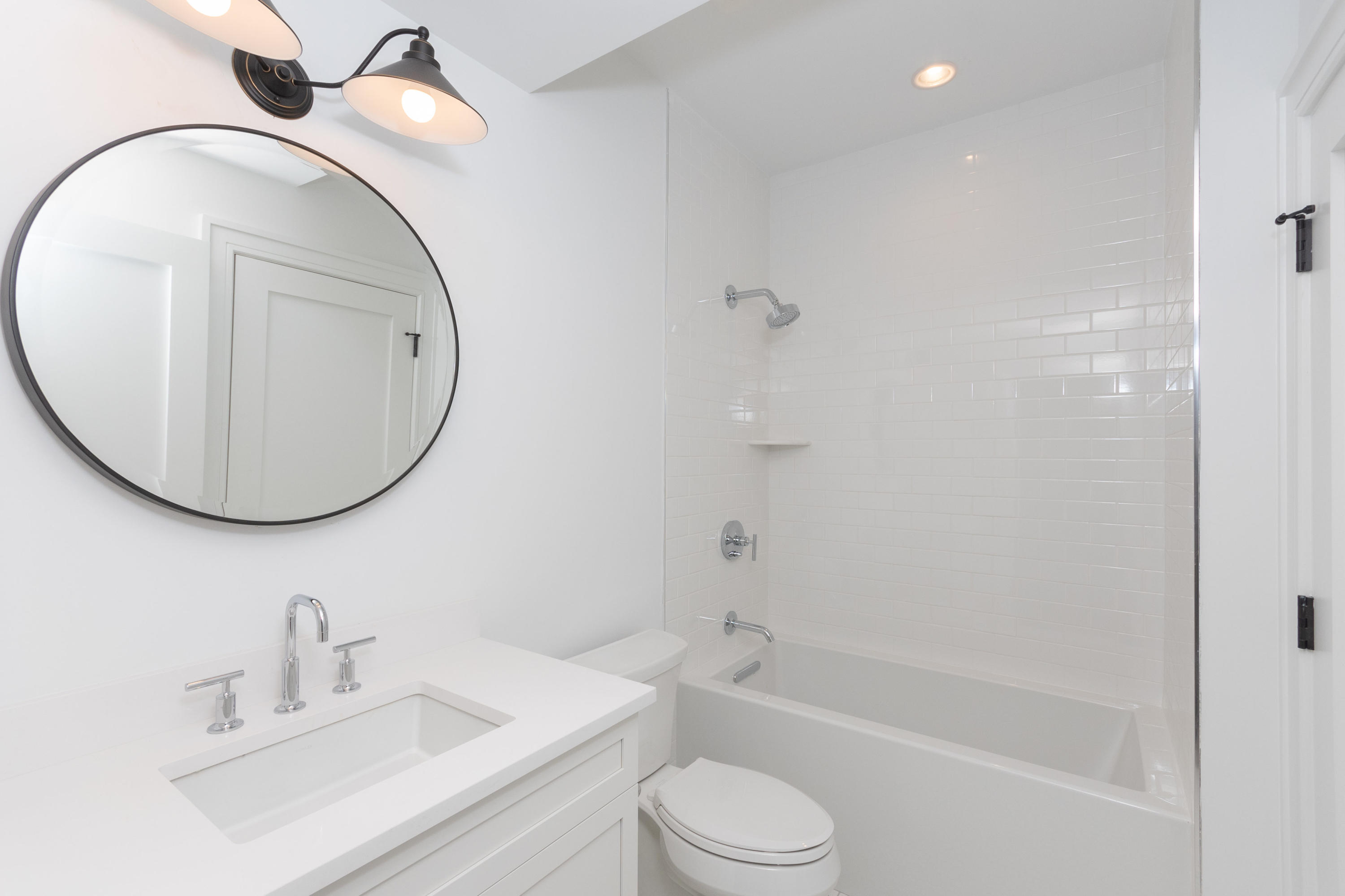 113 Hollow Tree Ridge Road Darien, CT 06820 - Photo 39 of 48 a bathroom with a sink a toilet and a mirror