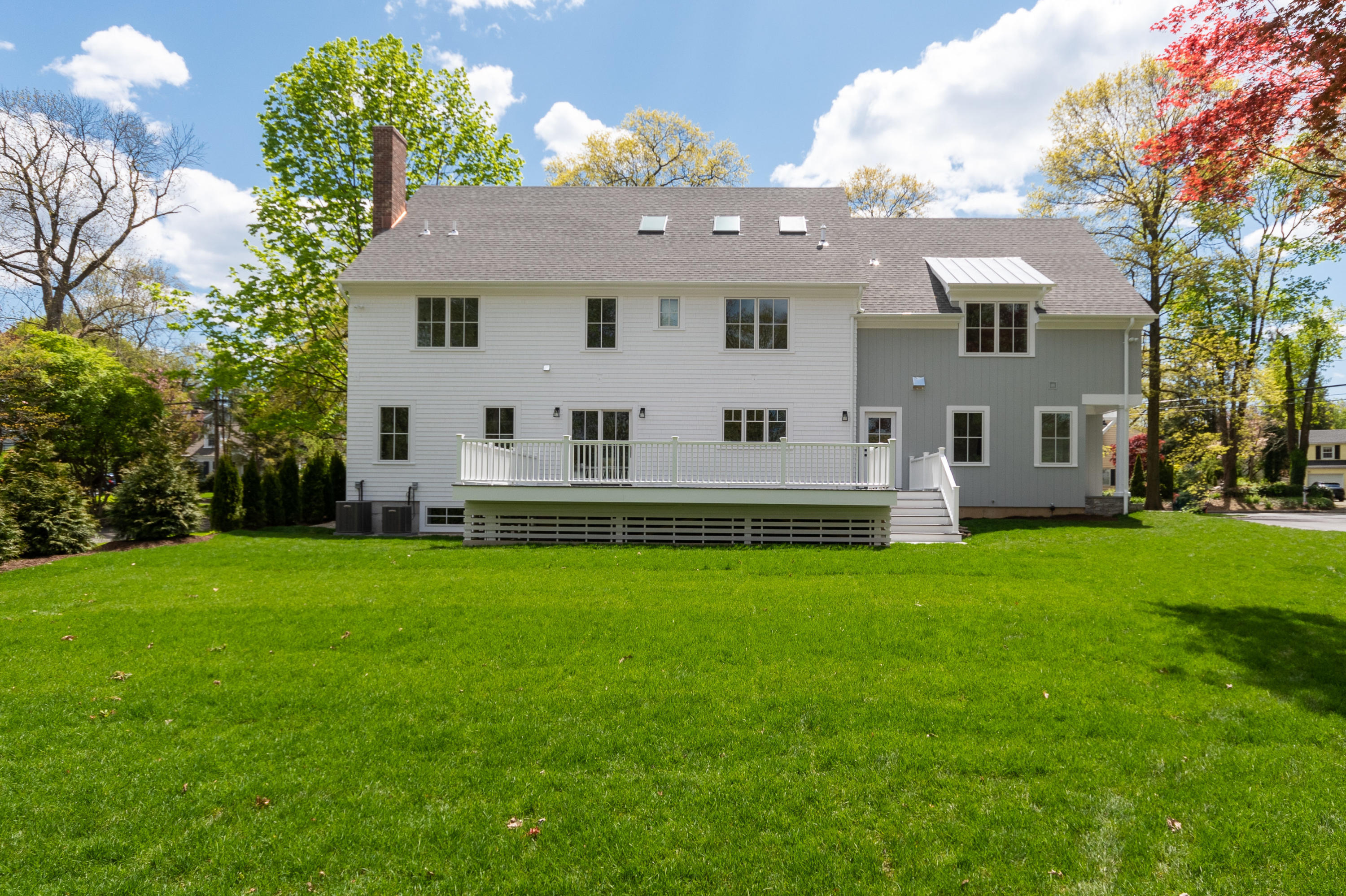 113 Hollow Tree Ridge Road Darien, CT 06820 - Photo 42 of 48 a front view of a house with a garden and yard
