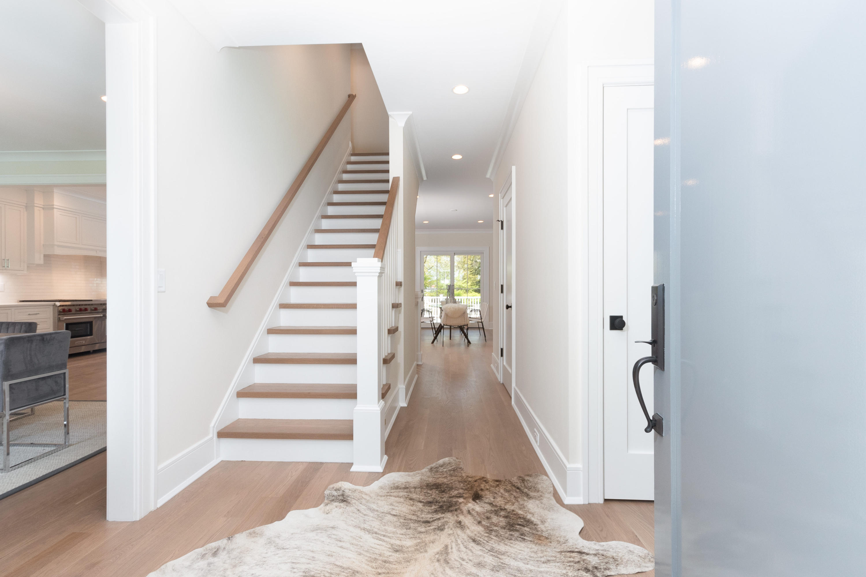 113 Hollow Tree Ridge Road Darien, CT 06820 - Photo 6 of 48 a view of entryway with wooden floor and stairs