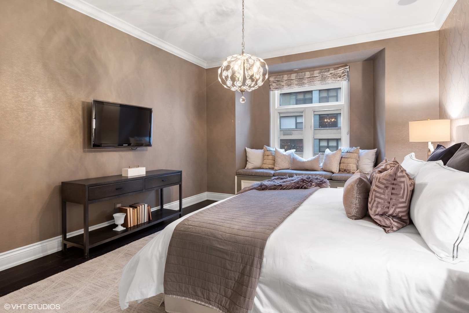 222 East Chestnut Street, Unit 8A Chicago, IL 60611 - Photo 15 of 41 a bedroom with a bed and a flat screen tv