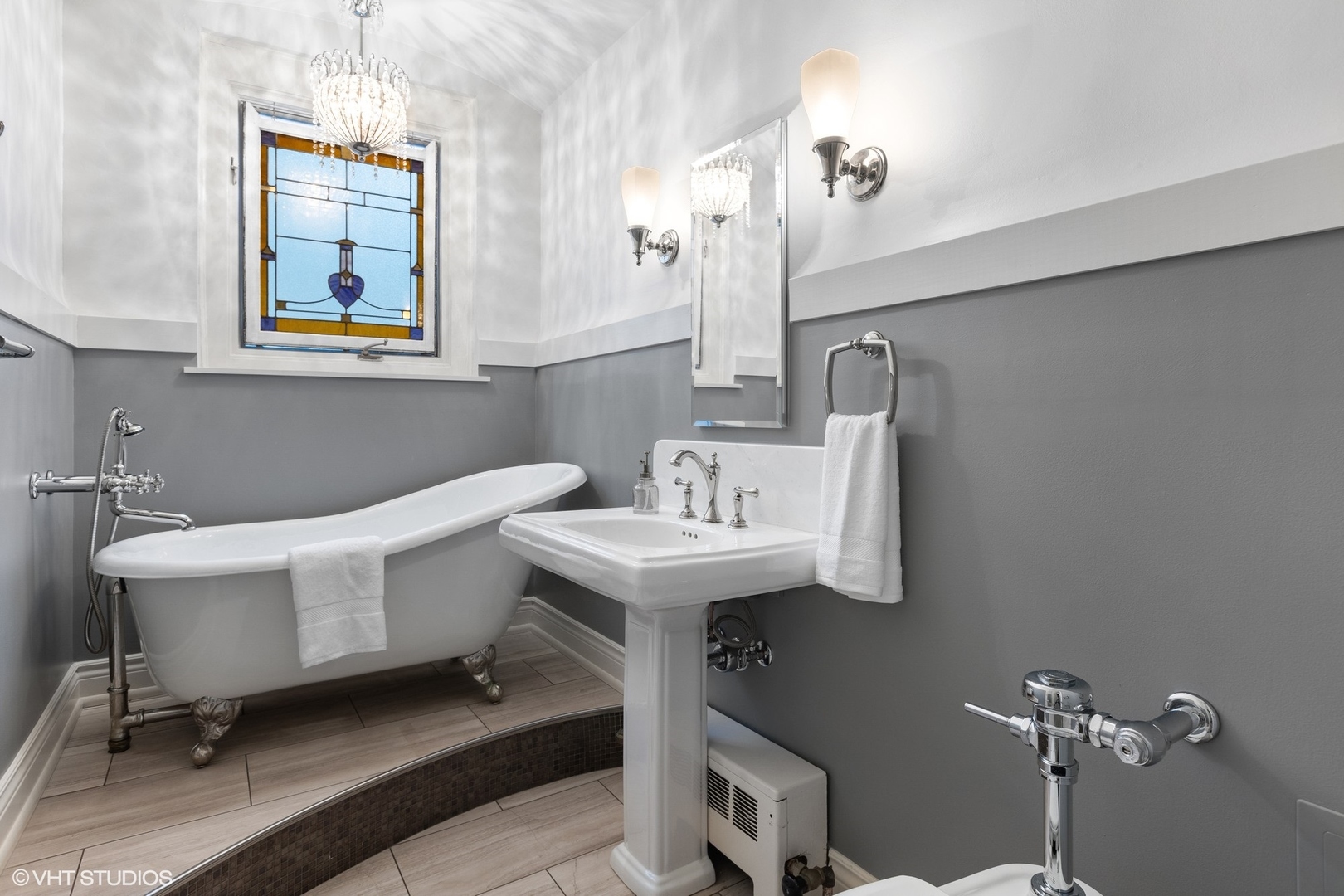 222 East Chestnut Street, Unit 8A Chicago, IL 60611 - Photo 17 of 41 a bathroom with a sink mirror and toilet