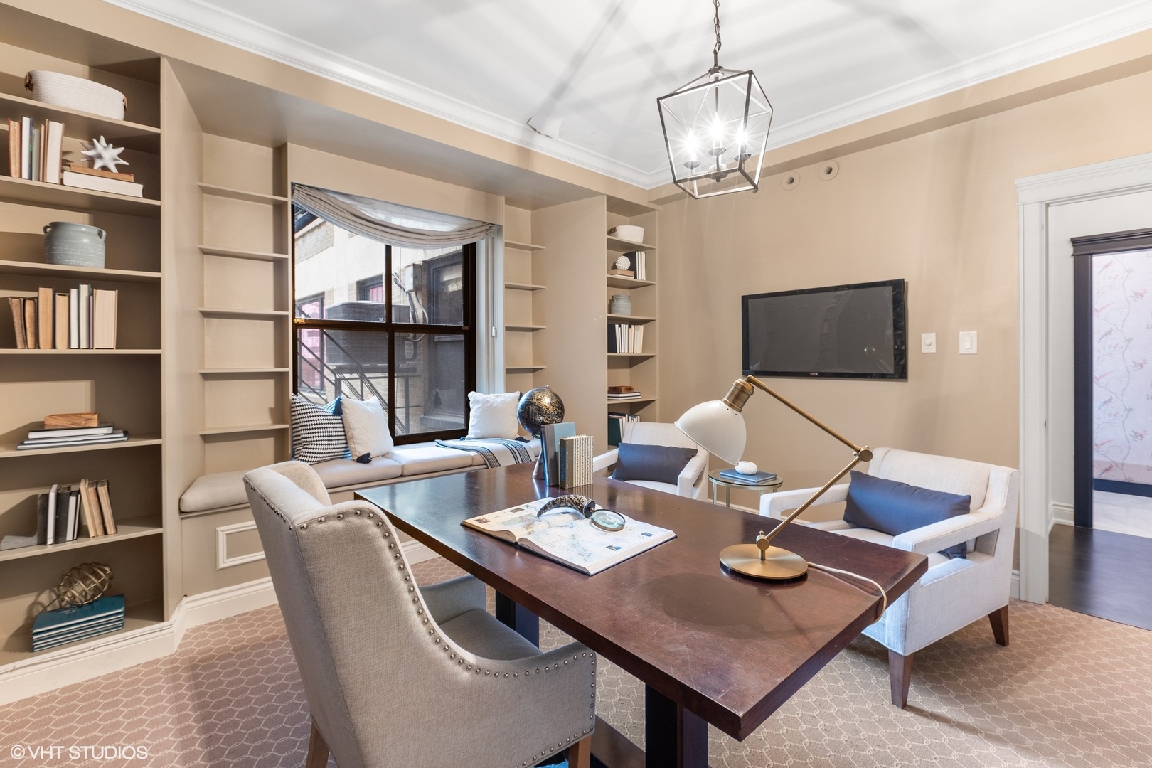 222 East Chestnut Street, Unit 8A Chicago, IL 60611 - Photo 18 of 41 a view of a dining room with furniture a rug and a flat screen tv