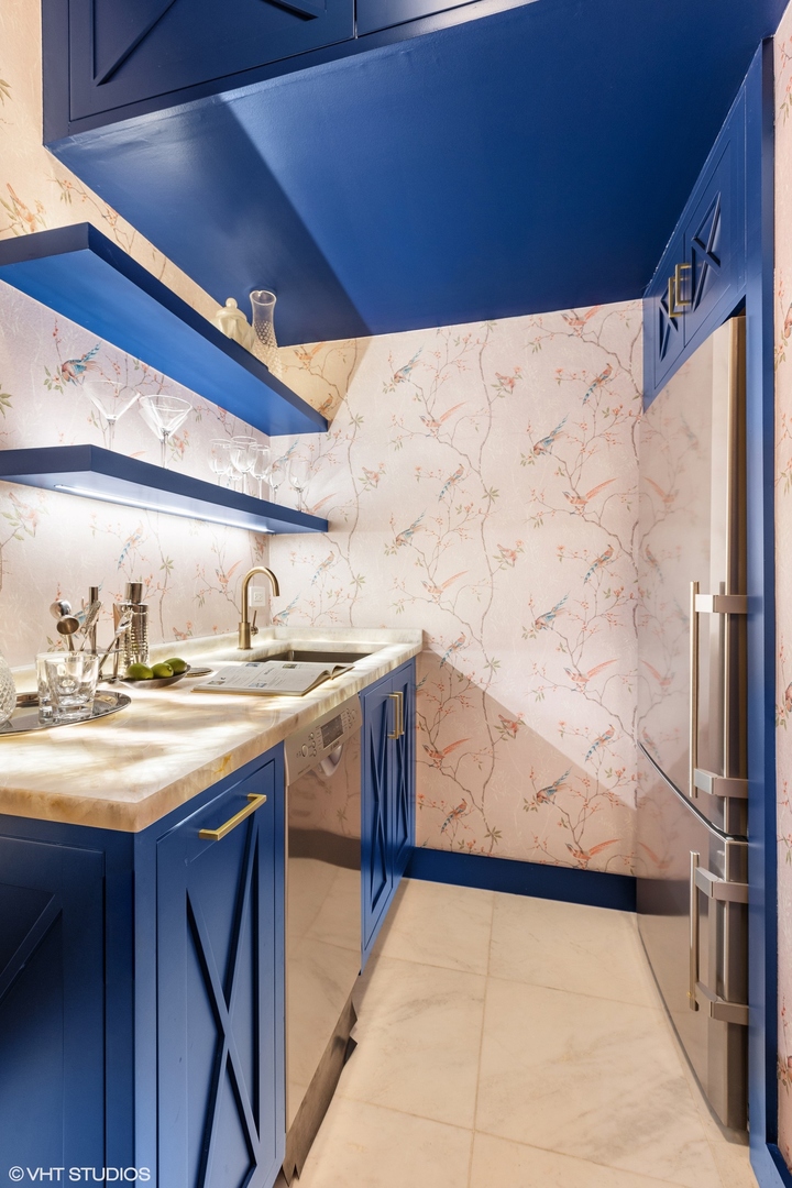 222 East Chestnut Street, Unit 8A Chicago, IL 60611 - Photo 20 of 41 a kitchen with a sink a stove and cabinets