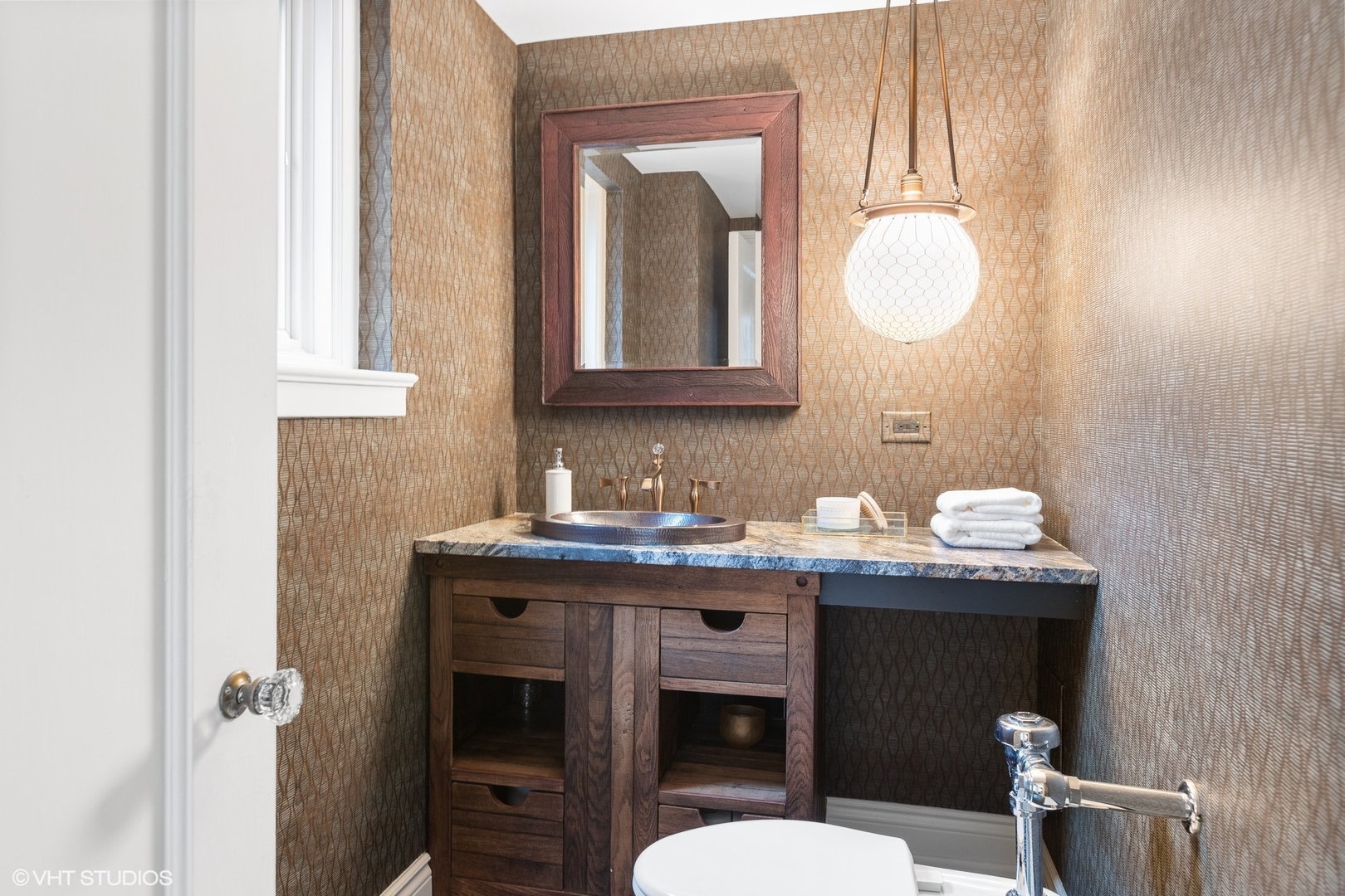 222 East Chestnut Street, Unit 8A Chicago, IL 60611 - Photo 25 of 41 a bathroom with a granite countertop sink a toilet and a mirror