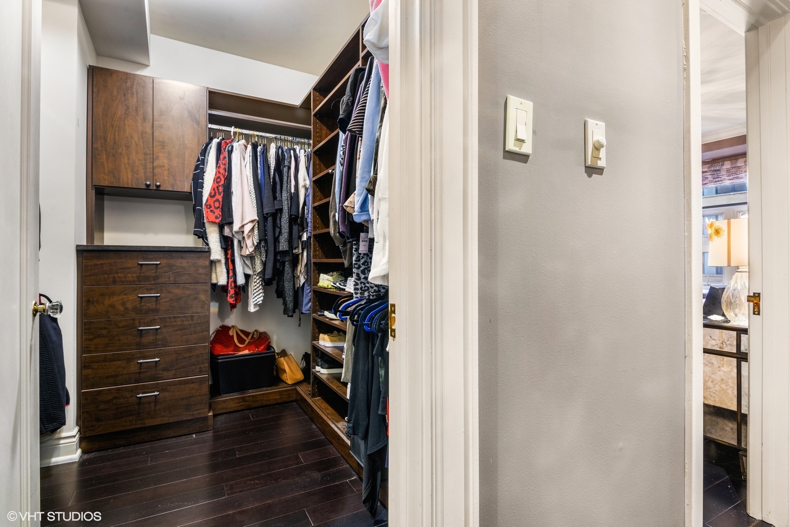 222 East Chestnut Street, Unit 8A Chicago, IL 60611 - Photo 26 of 41 a view of walk in closet with clothes and shoes