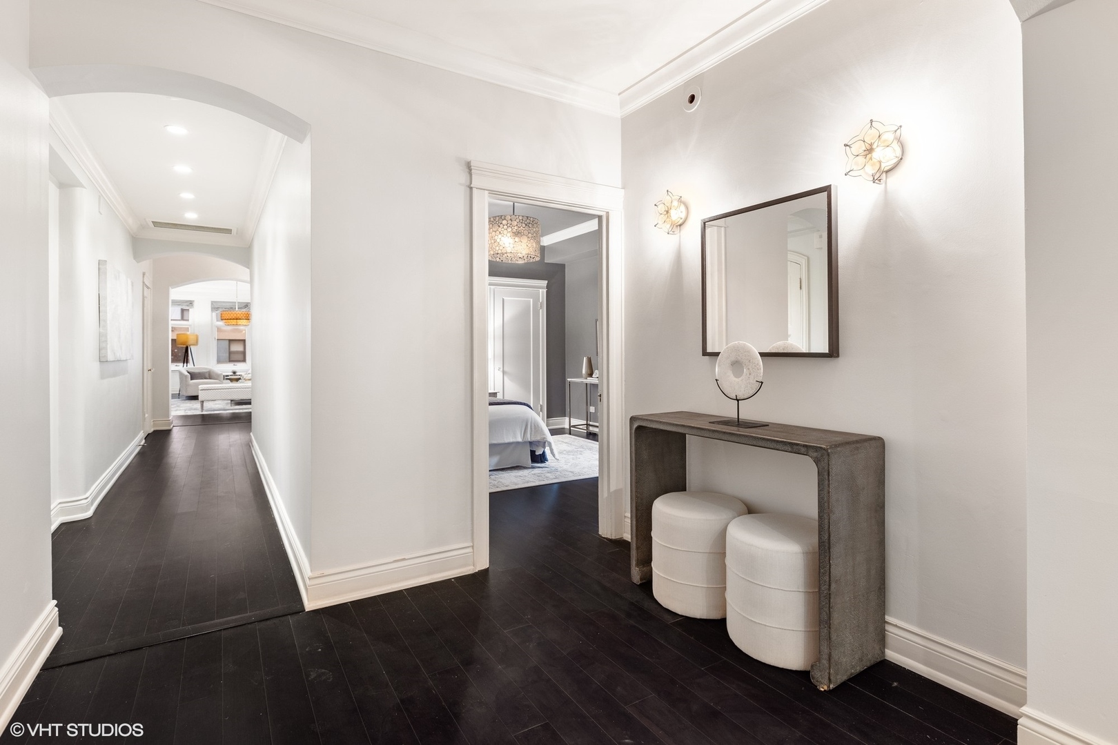 222 East Chestnut Street, Unit 8A Chicago, IL 60611 - Photo 3 of 41 a hallway with white cabinets and wooden floor