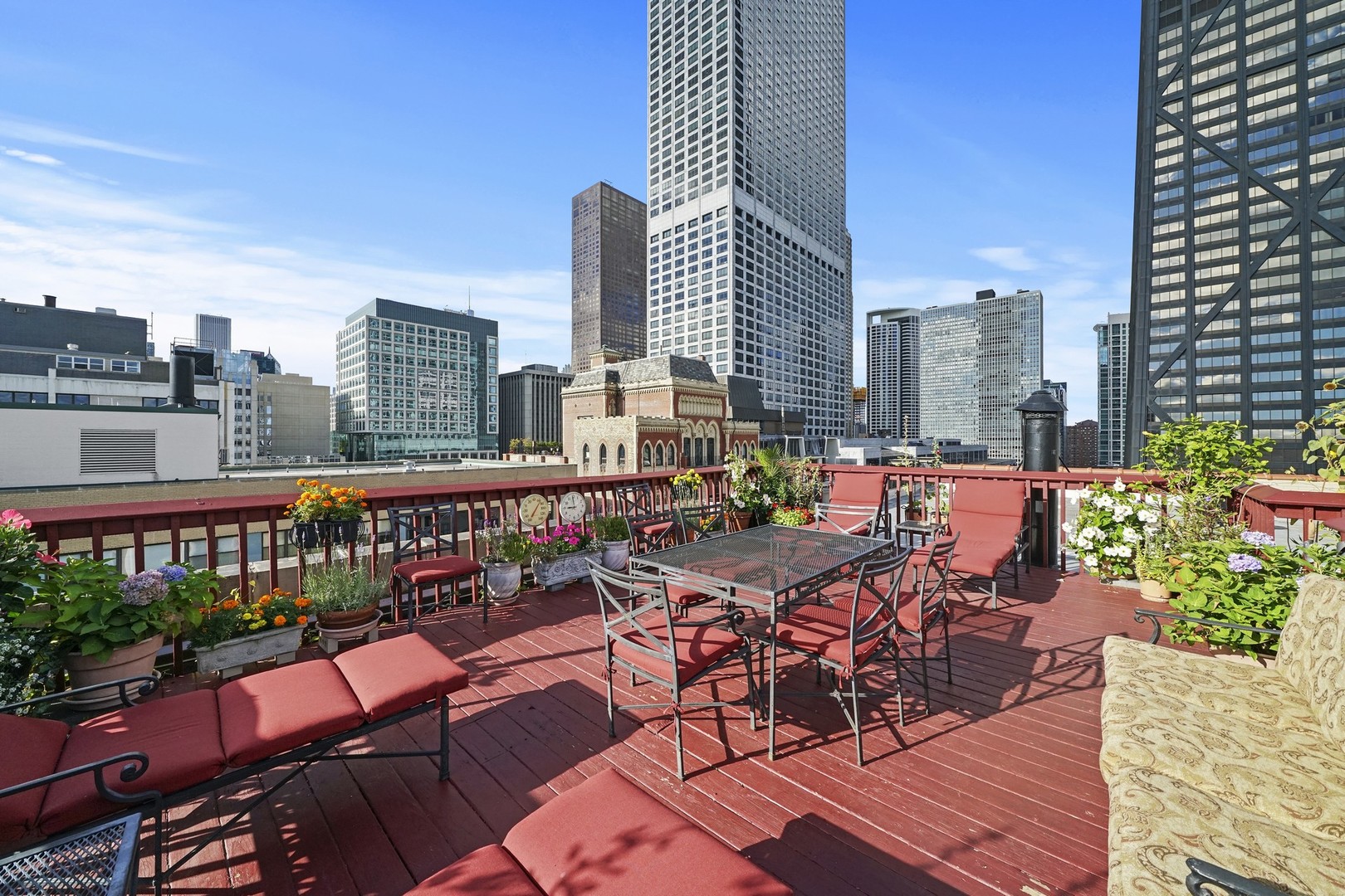 222 East Chestnut Street, Unit 8A Chicago, IL 60611 - Photo 32 of 41 a view of a balcony with chairs and a table