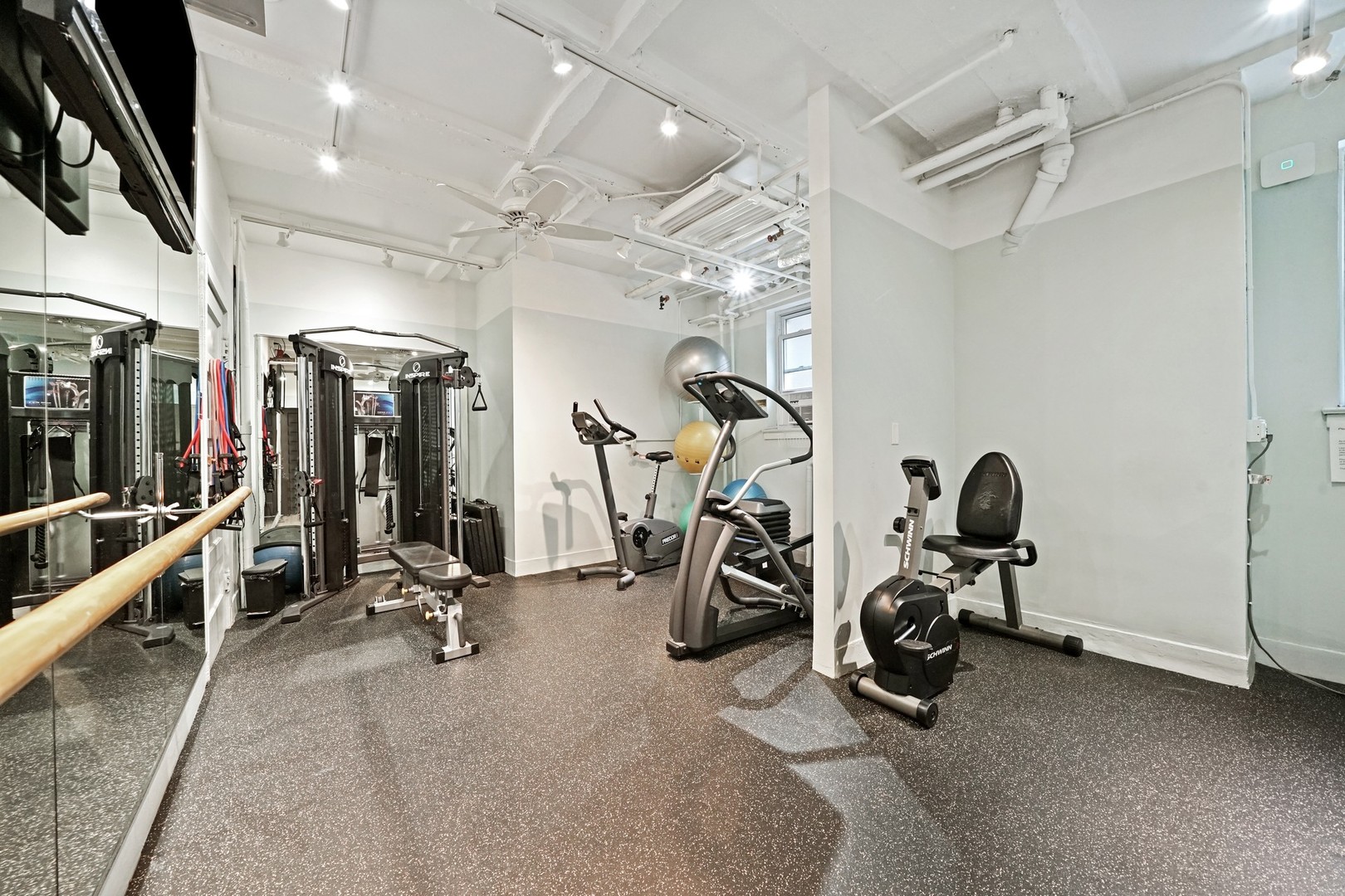 222 East Chestnut Street, Unit 8A Chicago, IL 60611 - Photo 33 of 41 a view of a room with gym equipment