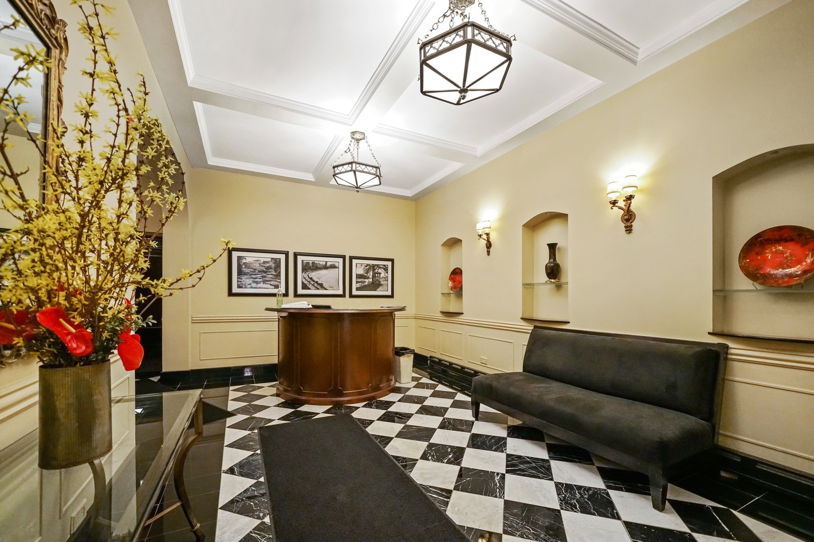 222 East Chestnut Street, Unit 8A Chicago, IL 60611 - Photo 35 of 41 a living room with a couch and a chandelier