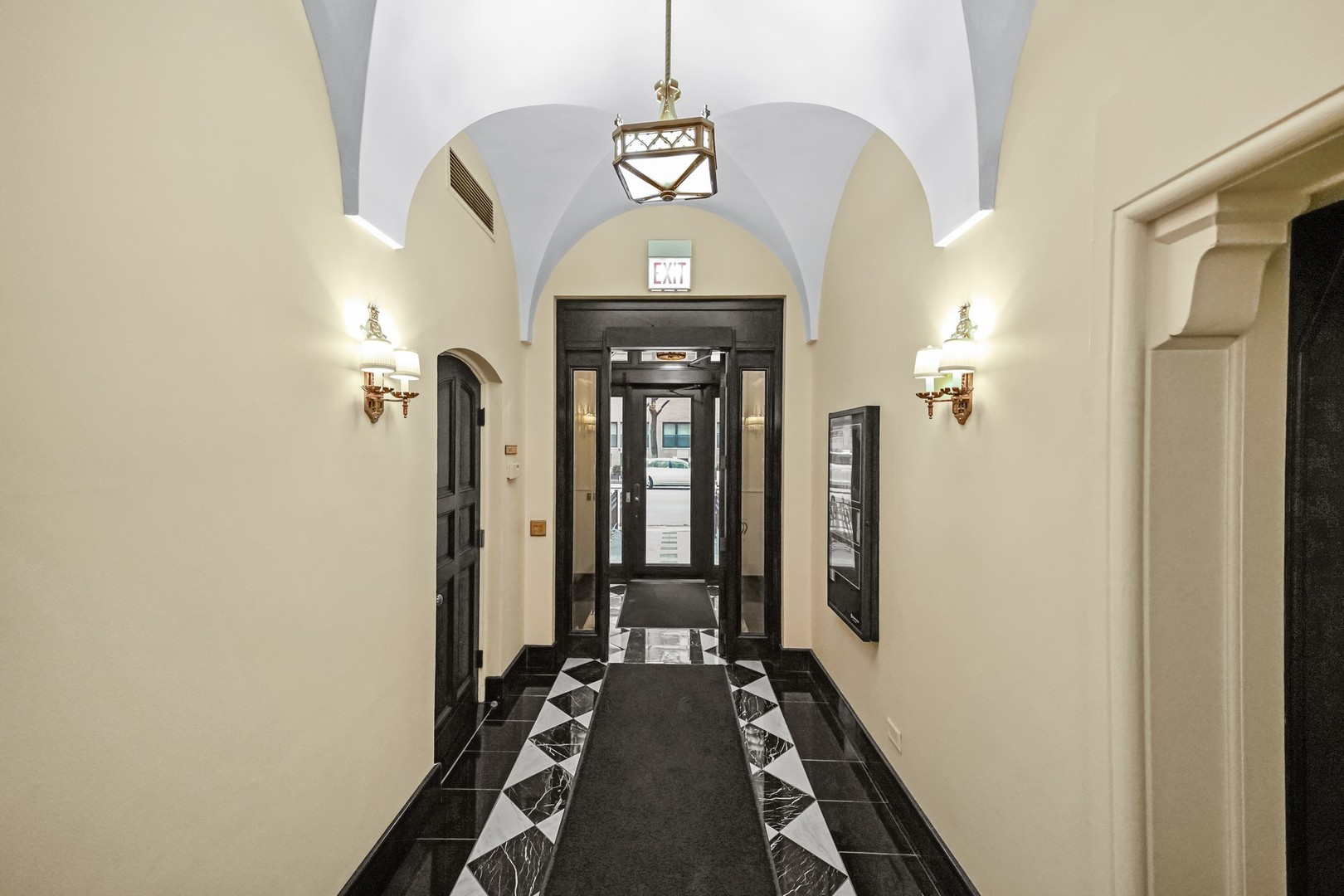 222 East Chestnut Street, Unit 8A Chicago, IL 60611 - Photo 36 of 41 a view of a hallway with wooden floor