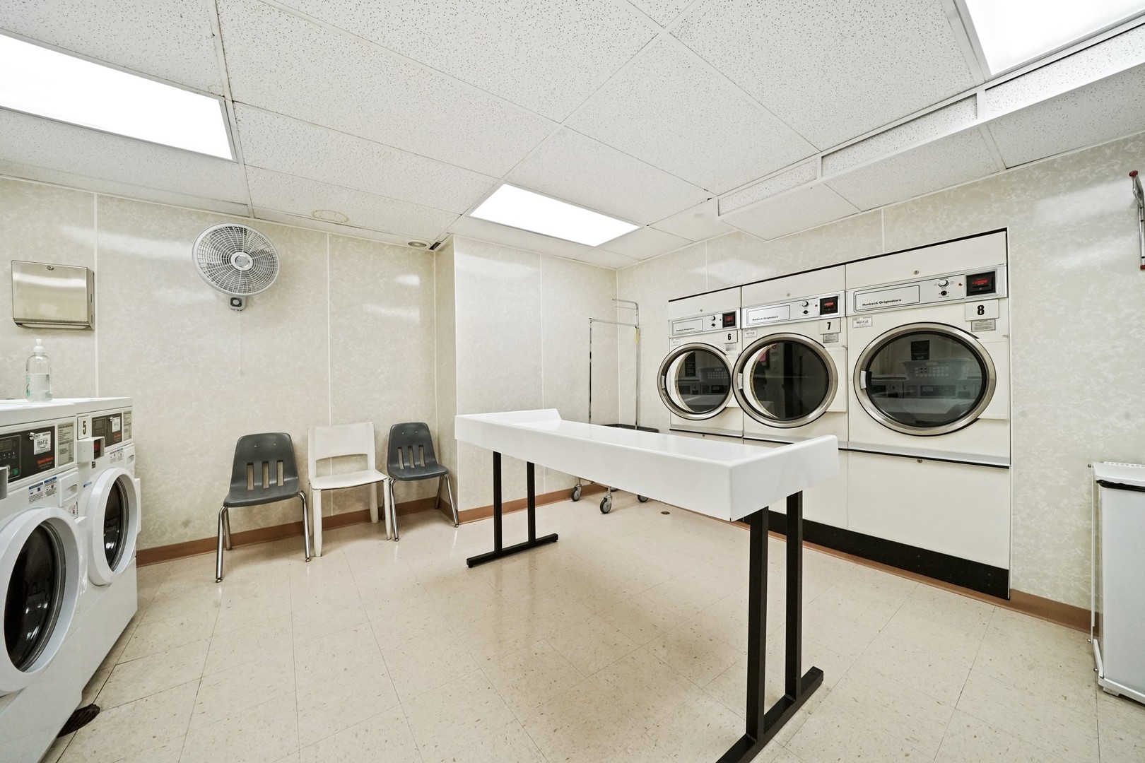 222 East Chestnut Street, Unit 8A Chicago, IL 60611 - Photo 38 of 41 a utility room with dryer and washer