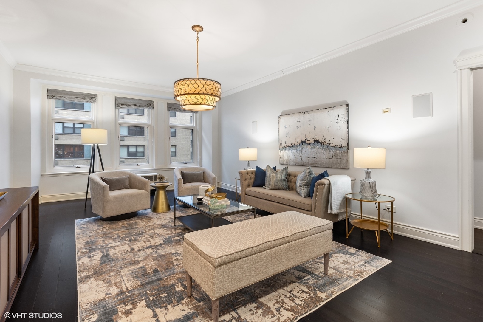 222 East Chestnut Street, Unit 8A Chicago, IL 60611 - Photo 6 of 41 a living room with furniture and a chandelier