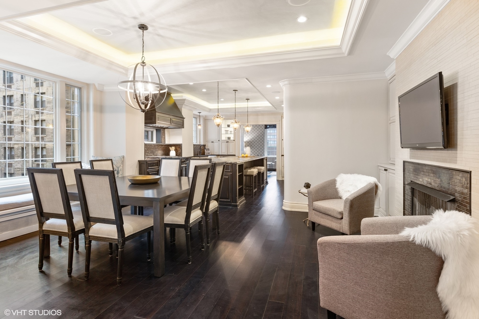 222 East Chestnut Street, Unit 8A Chicago, IL 60611 - Photo 7 of 41 a view of a dining room with furniture wooden floor and chandelier