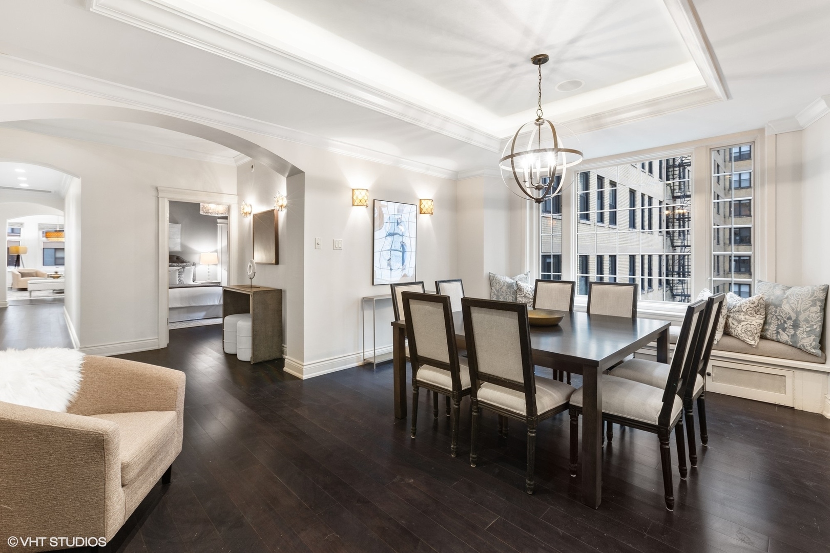 222 East Chestnut Street, Unit 8A Chicago, IL 60611 - Photo 8 of 41 a view of a dining room and livingroom with furniture wooden floor a chandelier