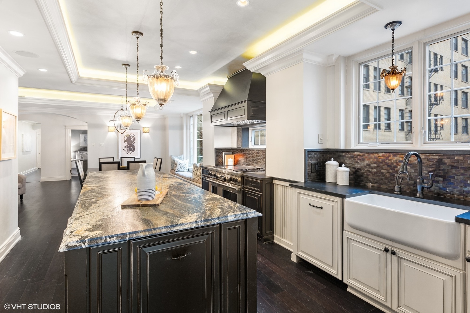 222 East Chestnut Street, Unit 8A Chicago, IL 60611 - Photo 10 of 41 a kitchen with kitchen island granite countertop a sink cabinets and stainless steel appliances