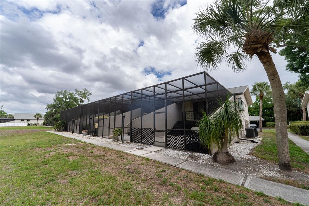 335 Bobby Jones Road, Unit 335 Sarasota, FL 34232 - Photo 5 of 16 a view of a house with a backyard