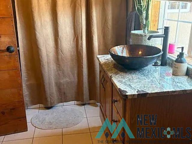 32 Hickey Road Pie Town, NM 87827 - Photo 9 of 39 Full bath with vanity and light tile patterned floors