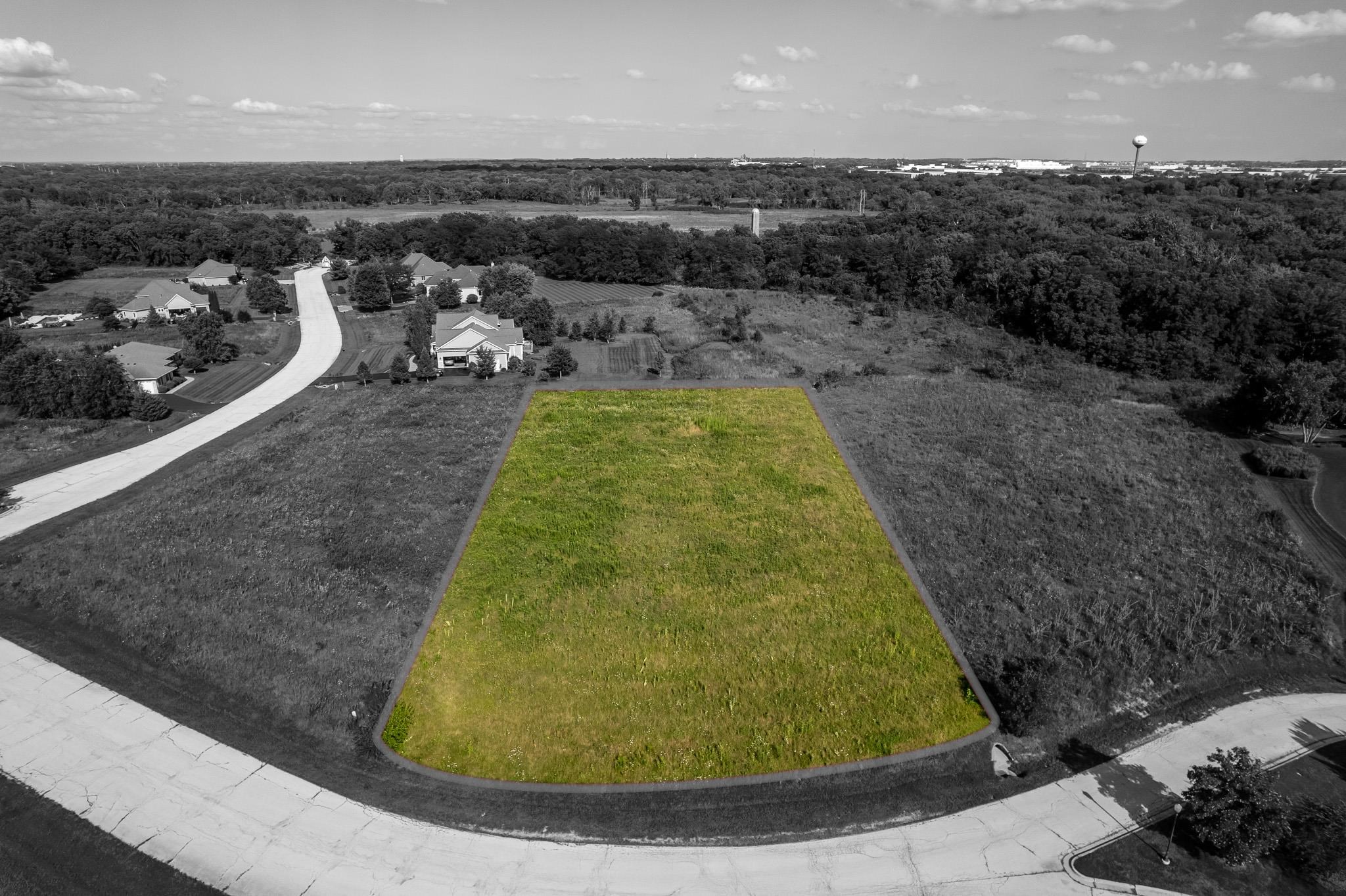 926 Driftwood Court Belvidere, IL 61008 - Photo 2 of 6 a view of a swimming pool with a yard and mountain view