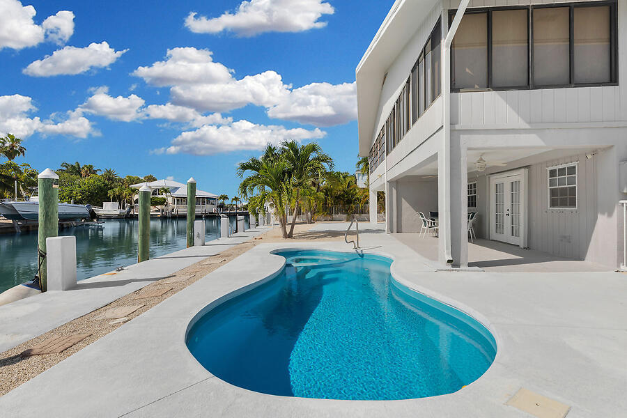 303 Sombrero Beach Road Marathon, FL 33050 - Photo 61 of 84 Enjoy your pool overlooking the canal