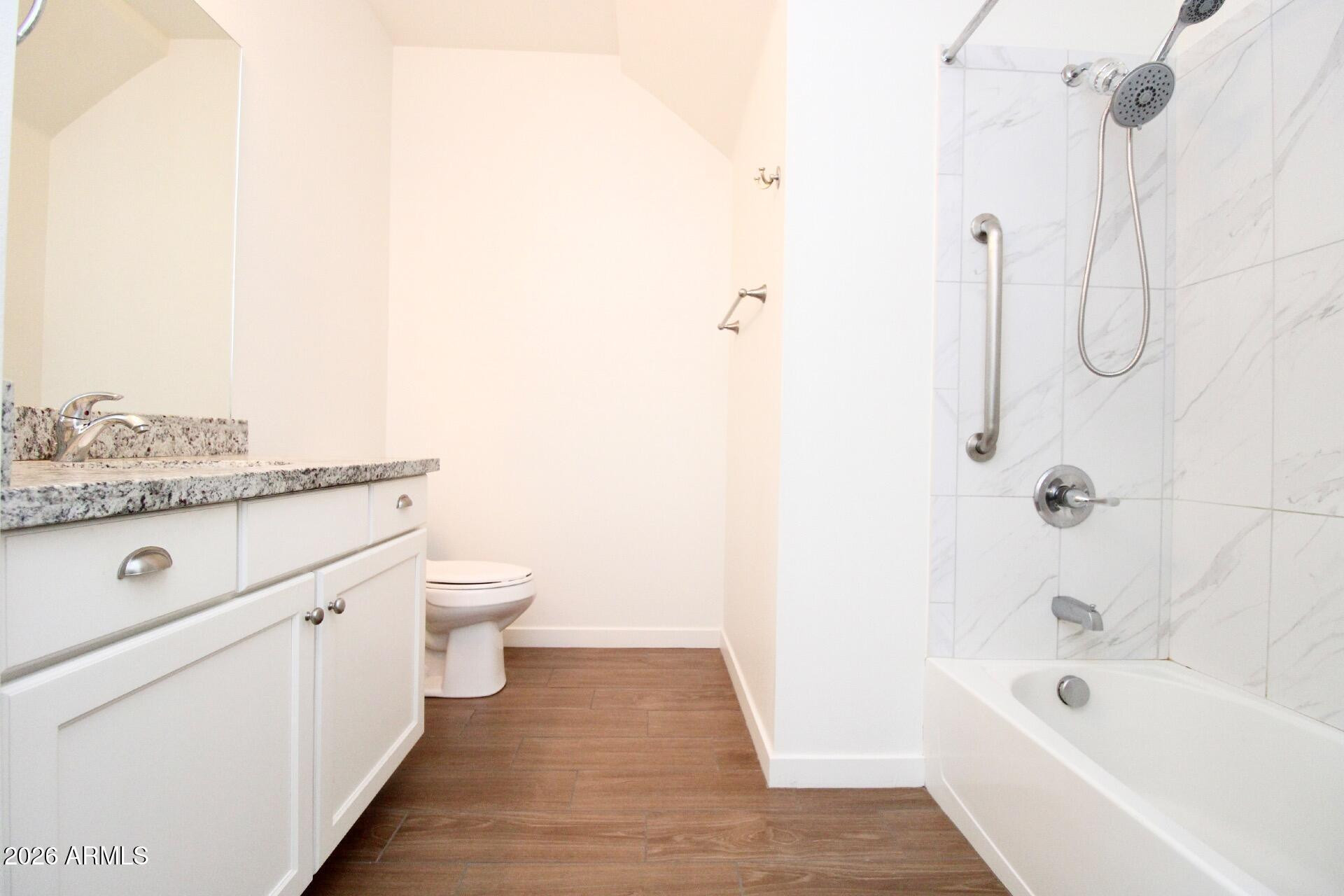 2511 West Queen Creek Road, Unit 438 Chandler, AZ 85248 - Photo 14 of 23 a bathroom with a granite countertop sink a toilet and shower
