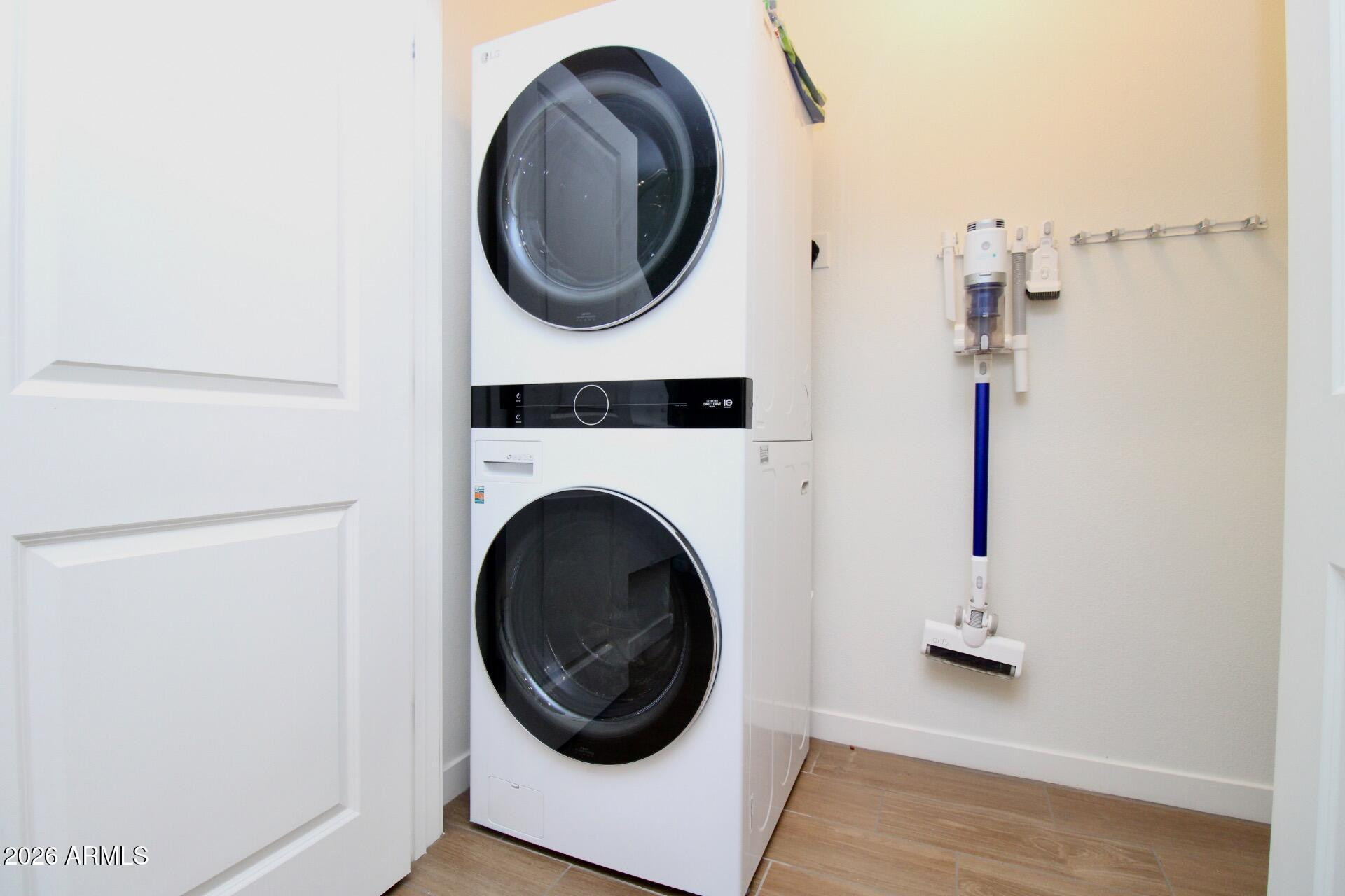 2511 West Queen Creek Road, Unit 438 Chandler, AZ 85248 - Photo 16 of 23 a close view of a utility room with dryer and washer